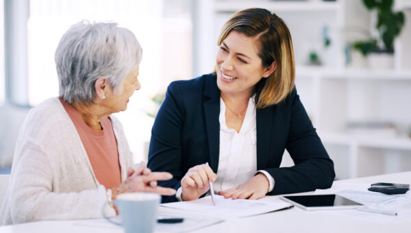 senior woman meeting with her female senior financial manager
