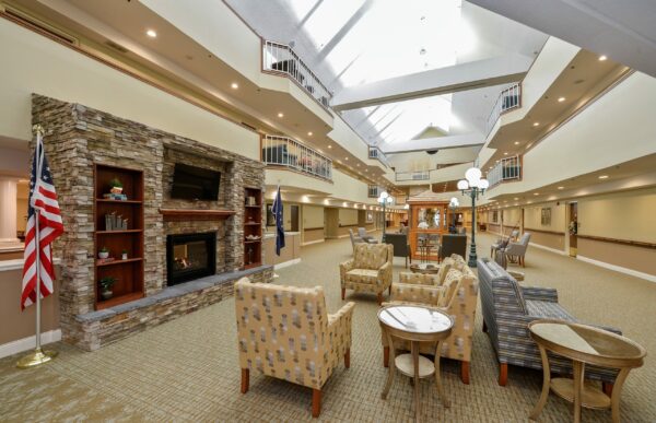 foyer area with a fireplace and seating