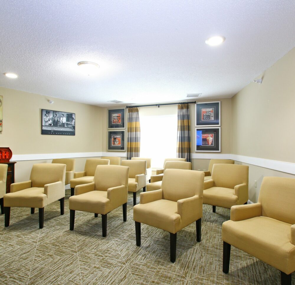 theatre room with yellow chairs