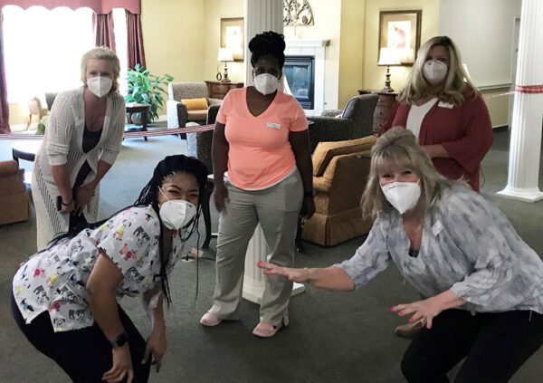 A group of team members posing at a Sonida Senior Living community.