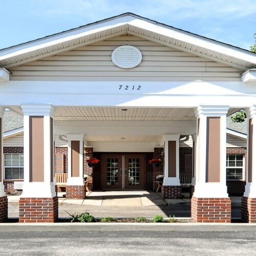 Covered front entrance at Wellington at Southport senior living community in Indianapolis, Indiana.