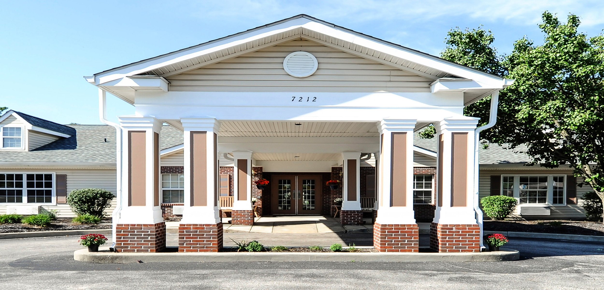 Covered front entrance at Wellington at Southport senior living community in Indianapolis, Indiana.