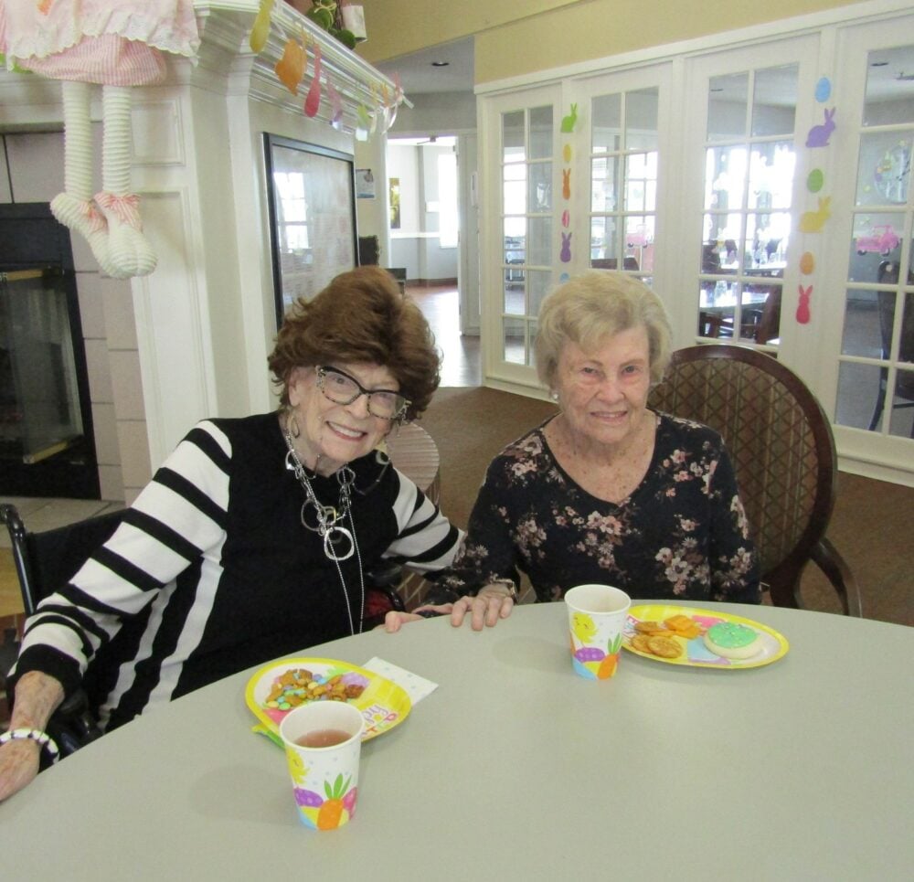 two women eating at a table during easter