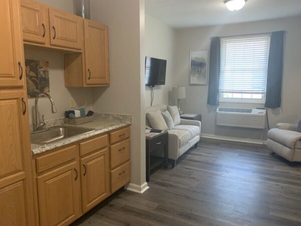 senior apartment with a kitchenette and living room near a window