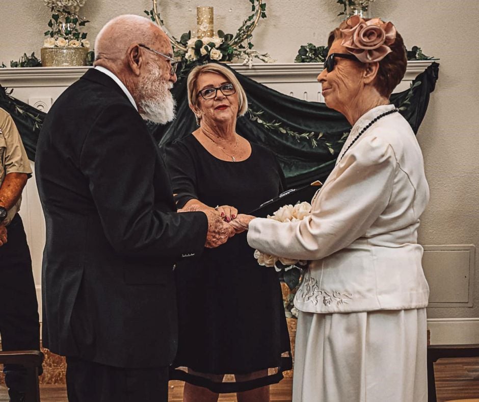 senior couple exchange vows during their wedding ceremony