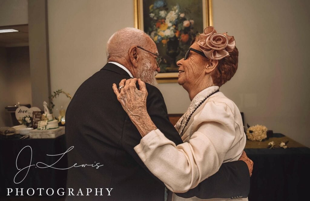senior man and senior woman dance together during their wedding