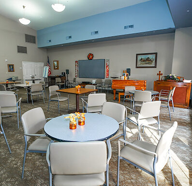 Cottonwood Village has a large gathering space with a piano, screen projector and seating areas