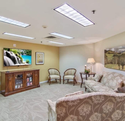 Cozy sitting area with a television at a senior living community in San Antonio, Texas.
