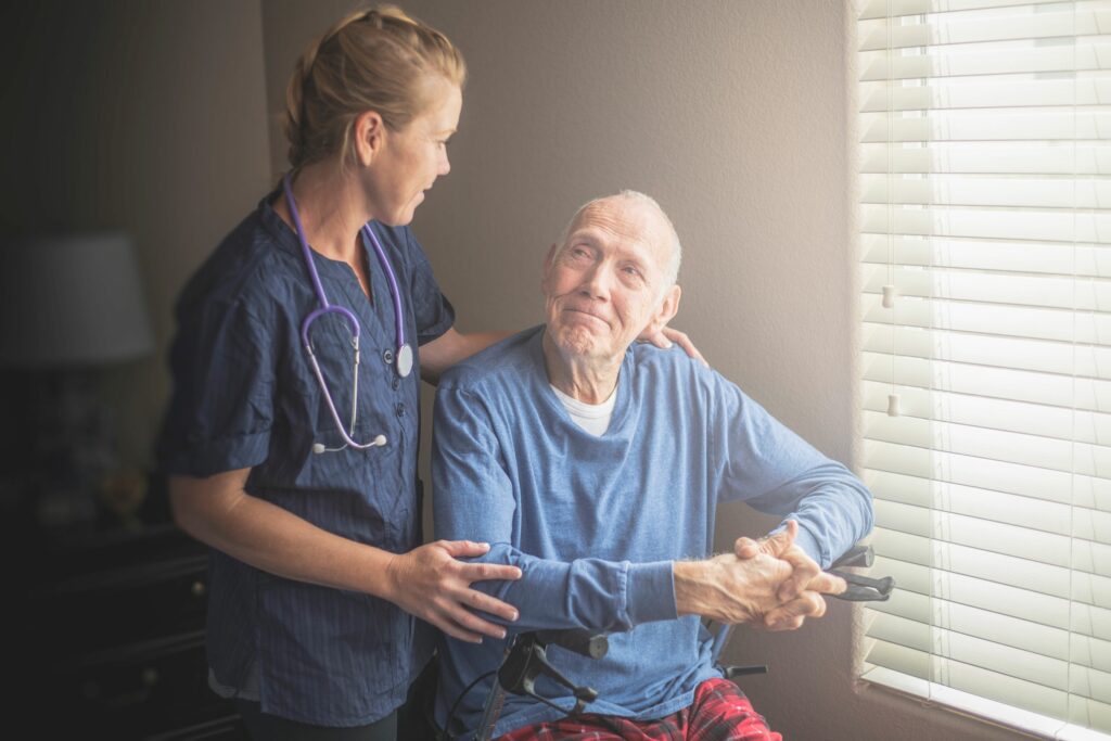 At-home nurse caregiver with a senior man