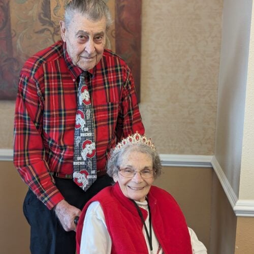 Senior couple, man and woman dressed in red for Valentines Day.