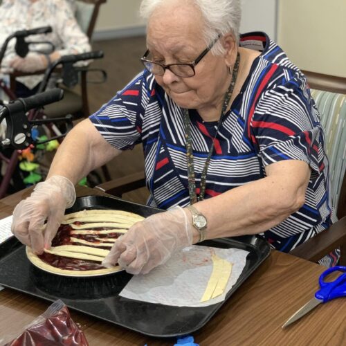 an old woman making pie