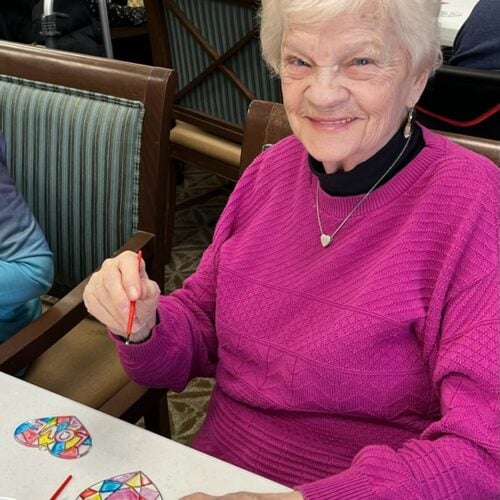 Senior woman painting