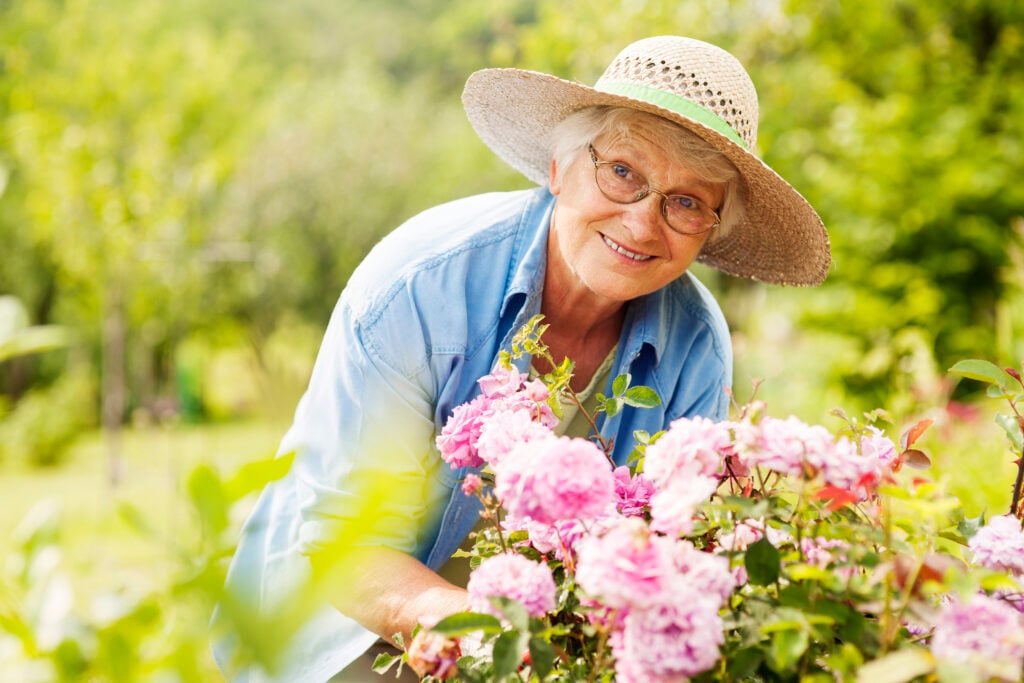 senior enjoying her garden