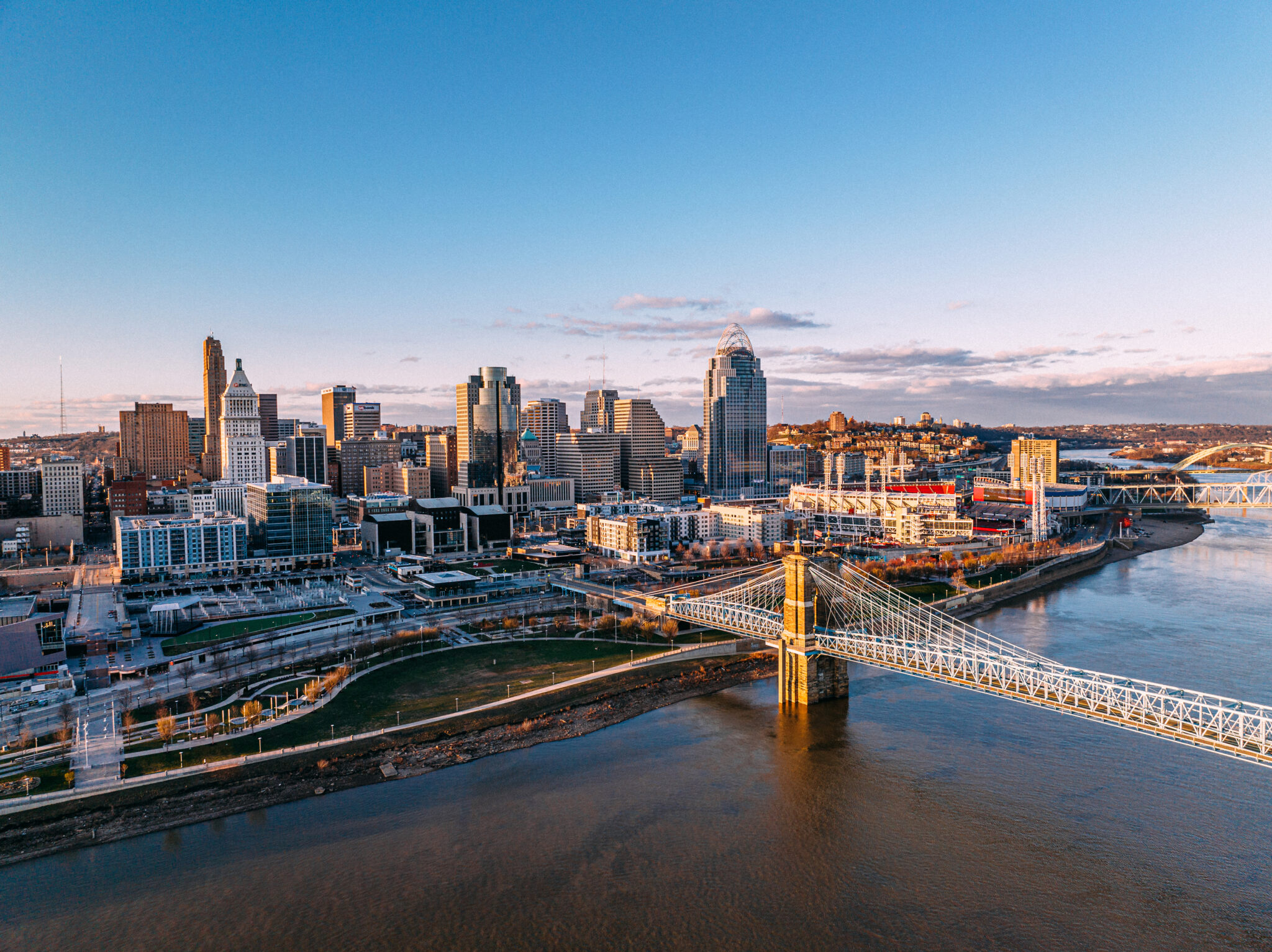 High angle view at sunset of the John A. Roebling Suspension Bridge with Downtown Cincinnati along the Ohio River