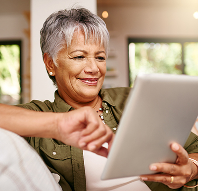 Woman on her iPad at a Sonida senior living community