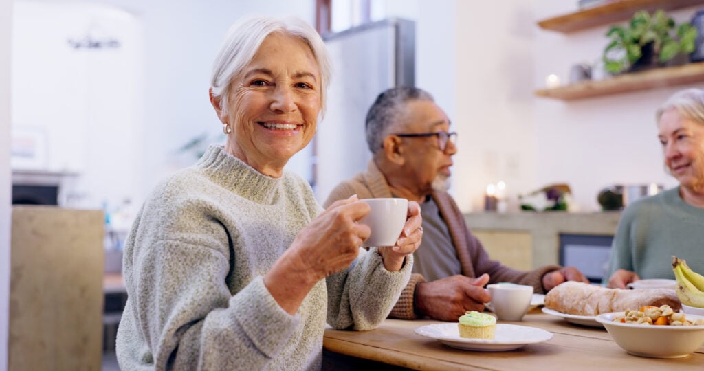 tea party and a group of senior people in the living room of a community
