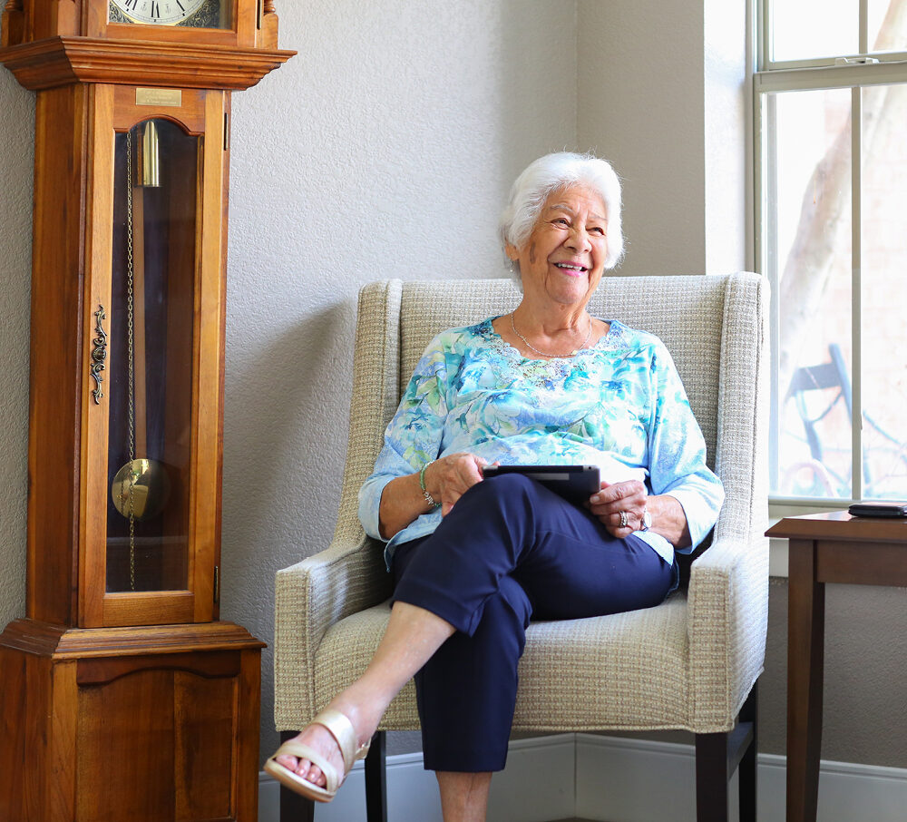 Woman at a senior living community enjoying a book