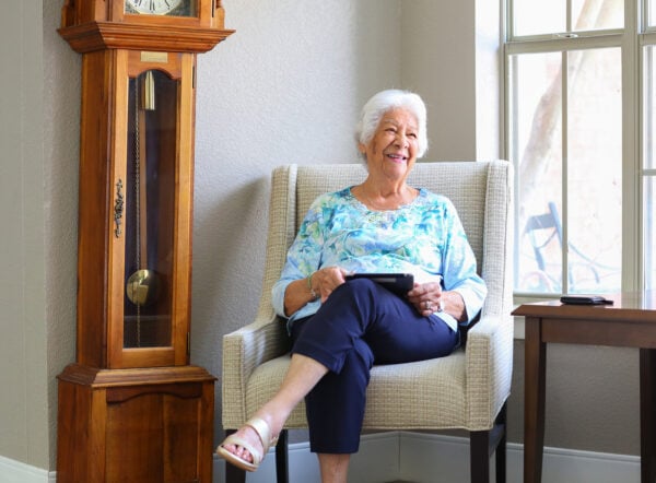 Woman at a senior living community enjoying a book