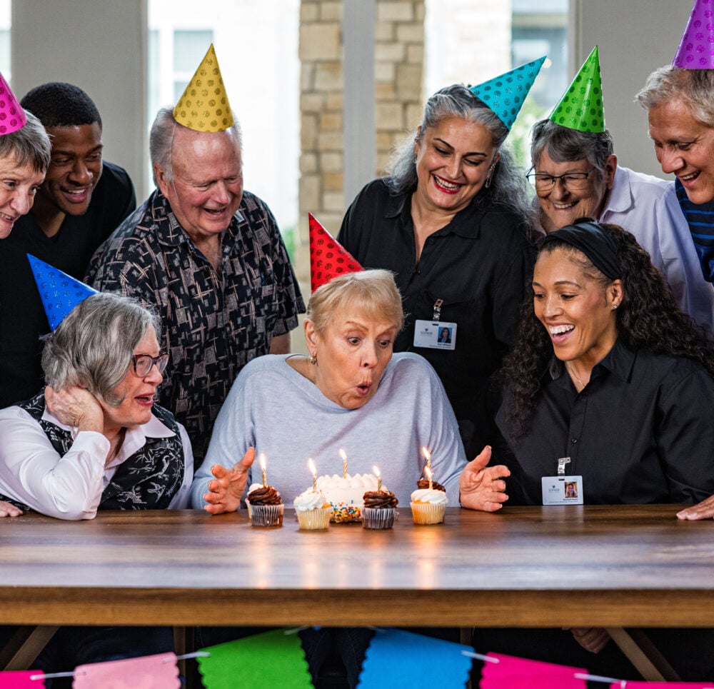 Seniors celebrating a birthday at a community