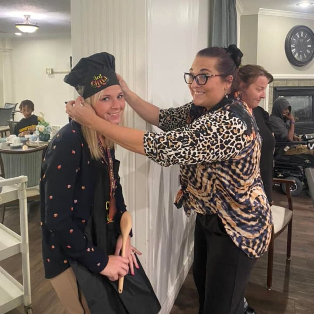 Team member being crowned a chili cook-off first place champion