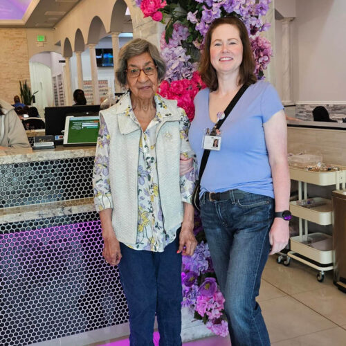 Tree of Dreams wish fulfilled as a resident poses with a caregiver after experiencing a Spa day.