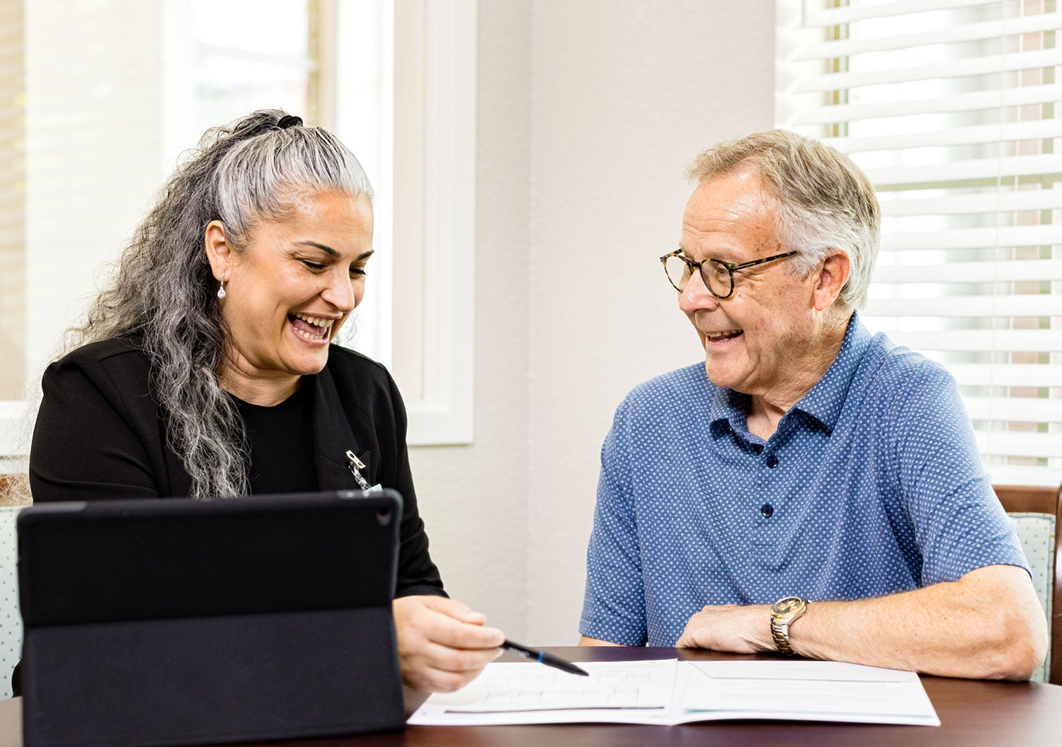 Senior man talking to a trusted advisor about senior living options
