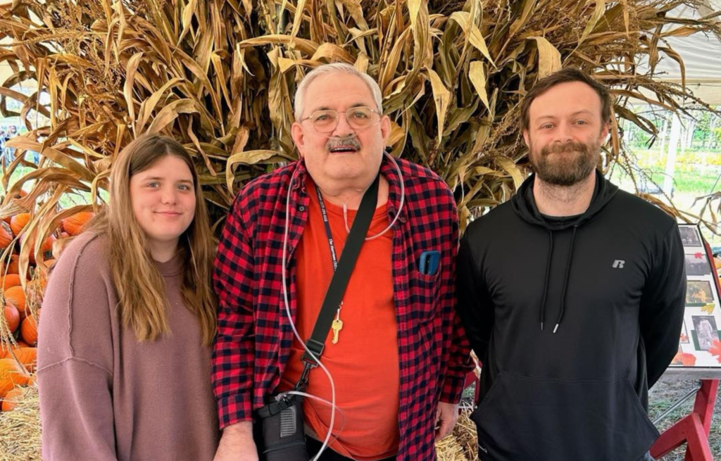 Resident enjoying pumpkin patch with family