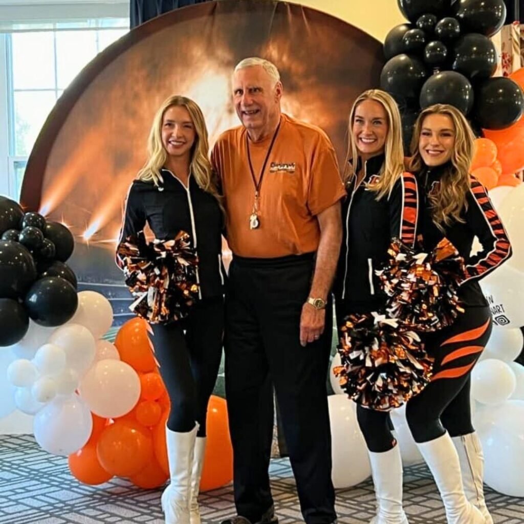 Bengals cheerleaders pose with resident