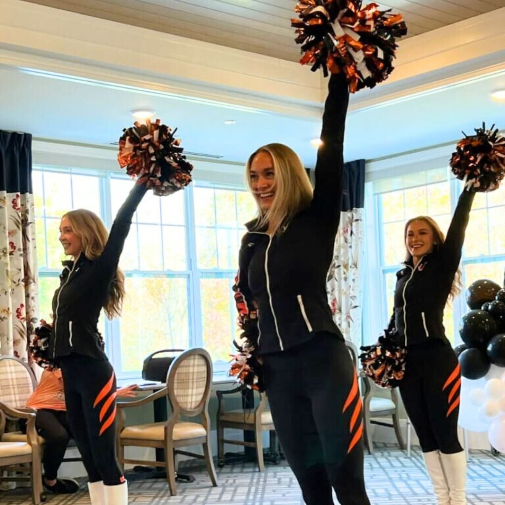 Bengals cheerleaders perform a routine in front of community