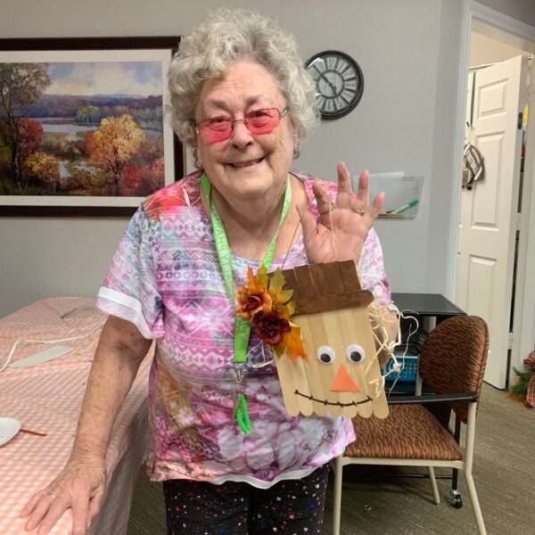 Mesquite resident showing her scarecrow craft