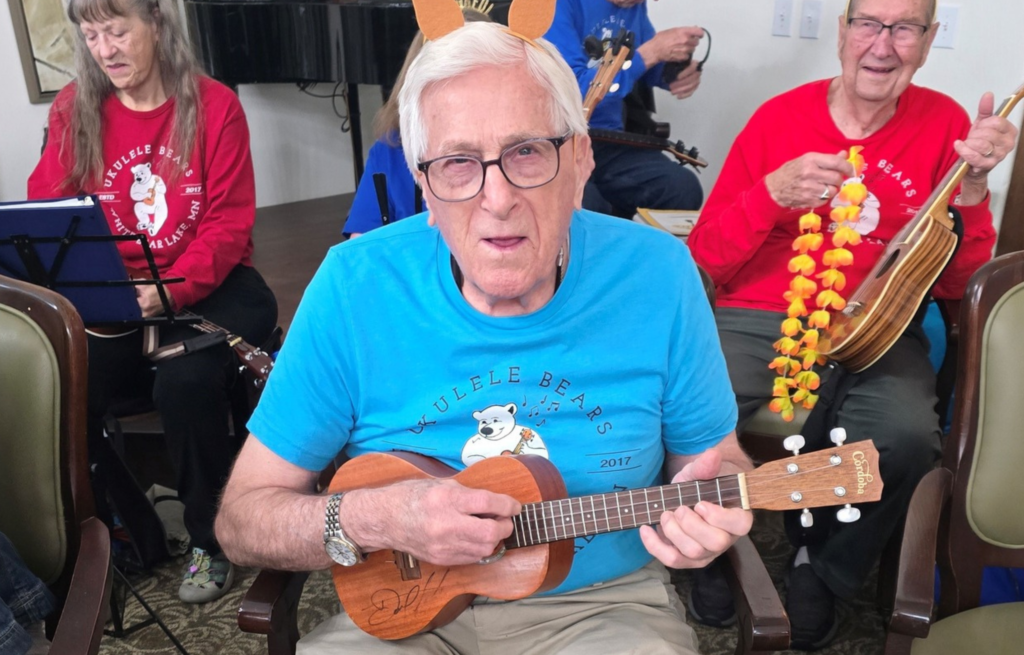 Resident performs with ukulele band