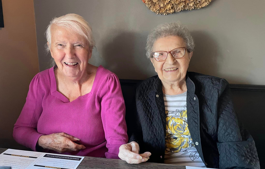 Two residents enjoy lunch at a local restaurant