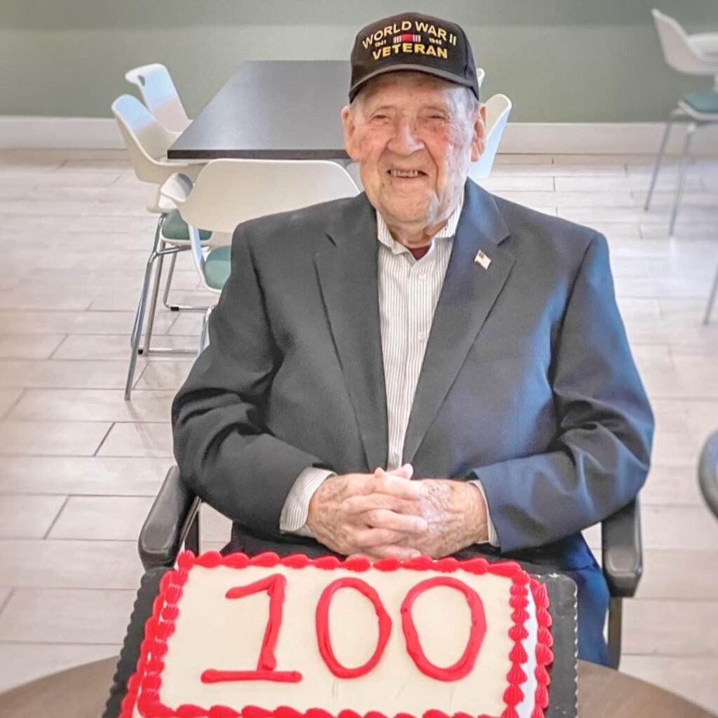 Resident smiles with birthday cake
