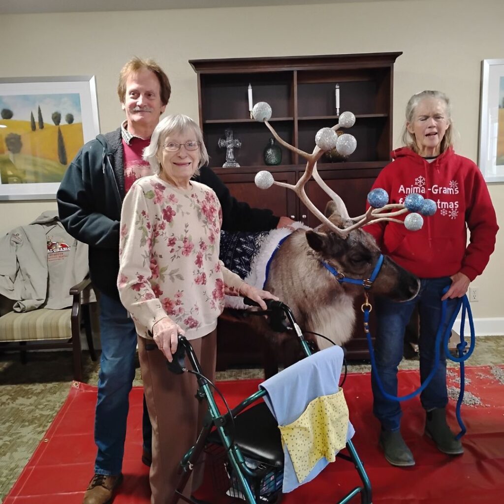 Group poses with reindeer