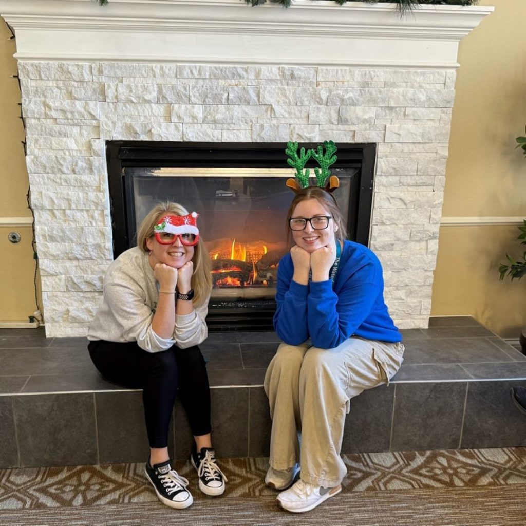 Mansfield team members pose in front of the fire