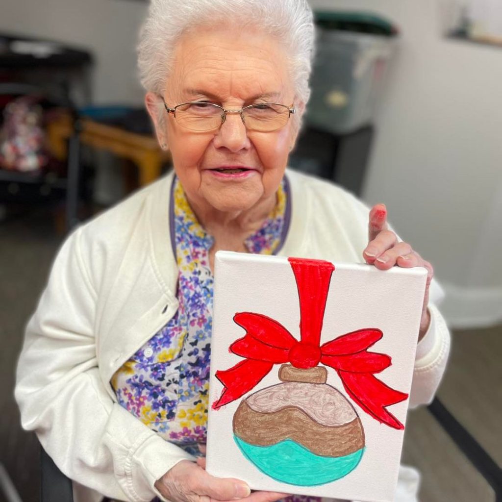 Resident enjoys Christmas painting activity