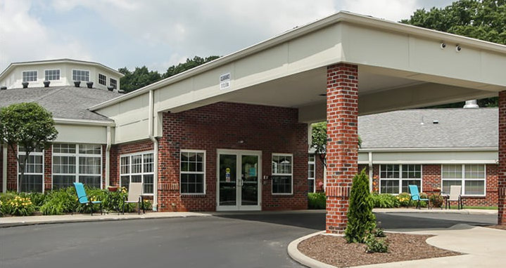 Entrance to senior living community in Lambertville, Michigan with red brick.