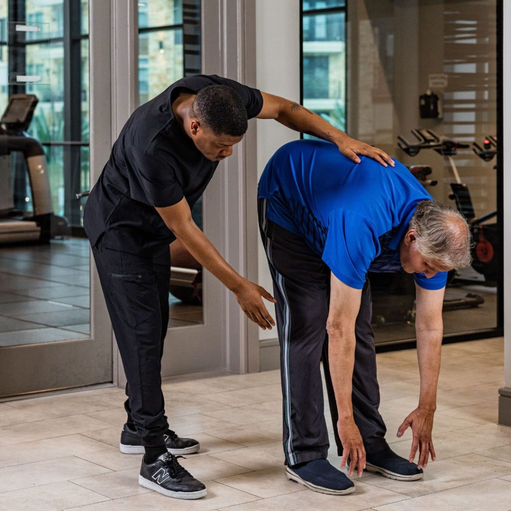 Senior stretching with wellness instructor