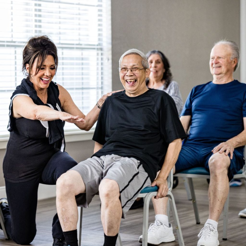 Senior fitness class doing chair exercises