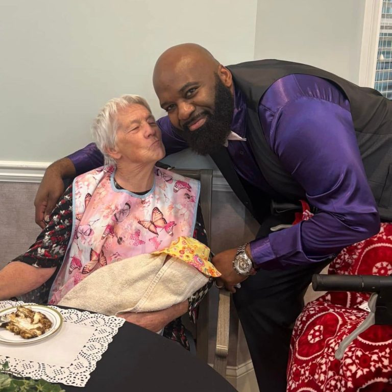 Narcoossee team member poses with resident