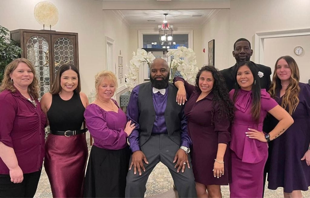 Narcoossee team poses in purple on carnation night