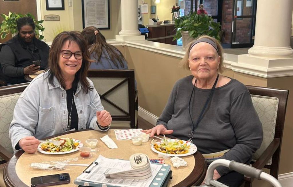 Magnolia Trails resident and daughter enjoying a meal