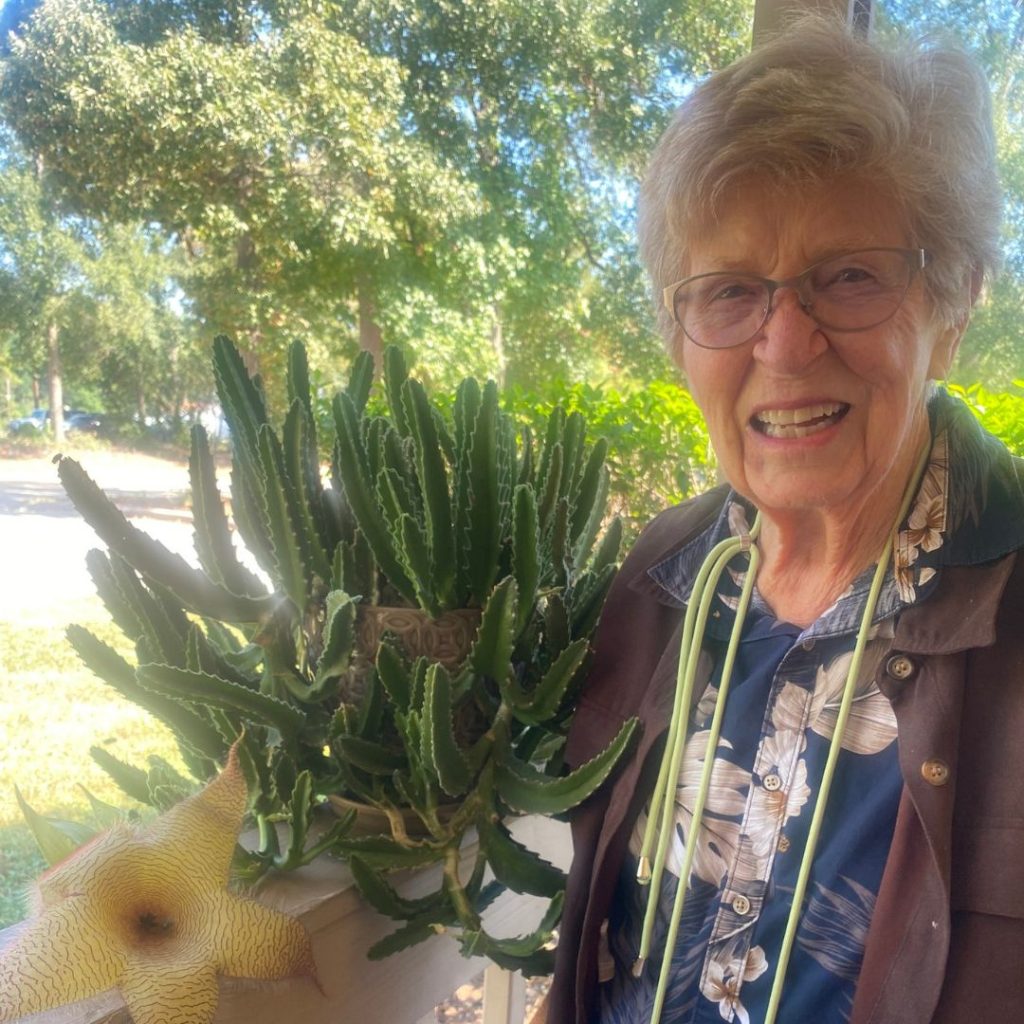 Resident poses with cactus