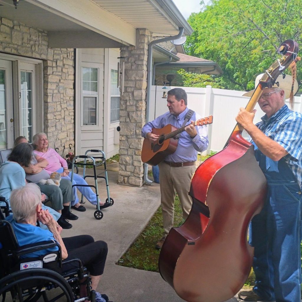Residents enjoying live music on the patio