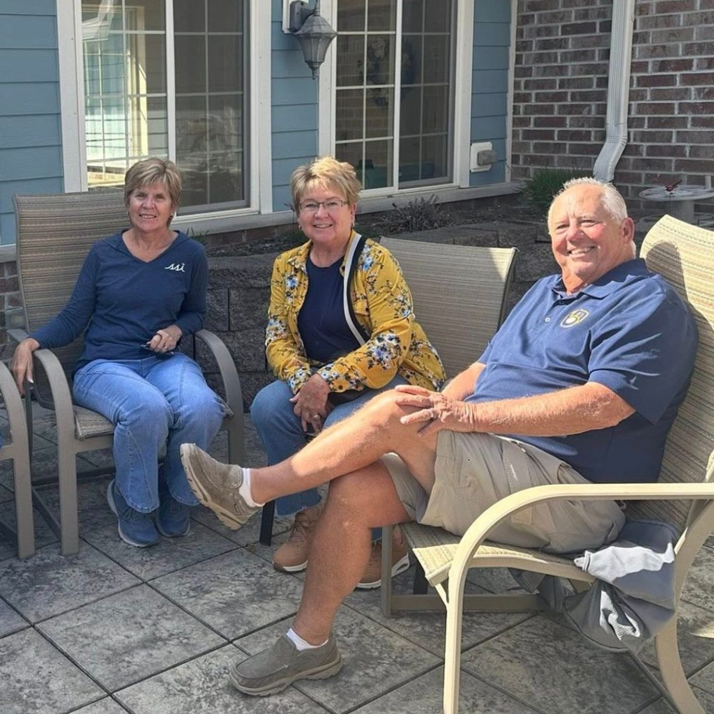 Residents enjoying social hour on patio