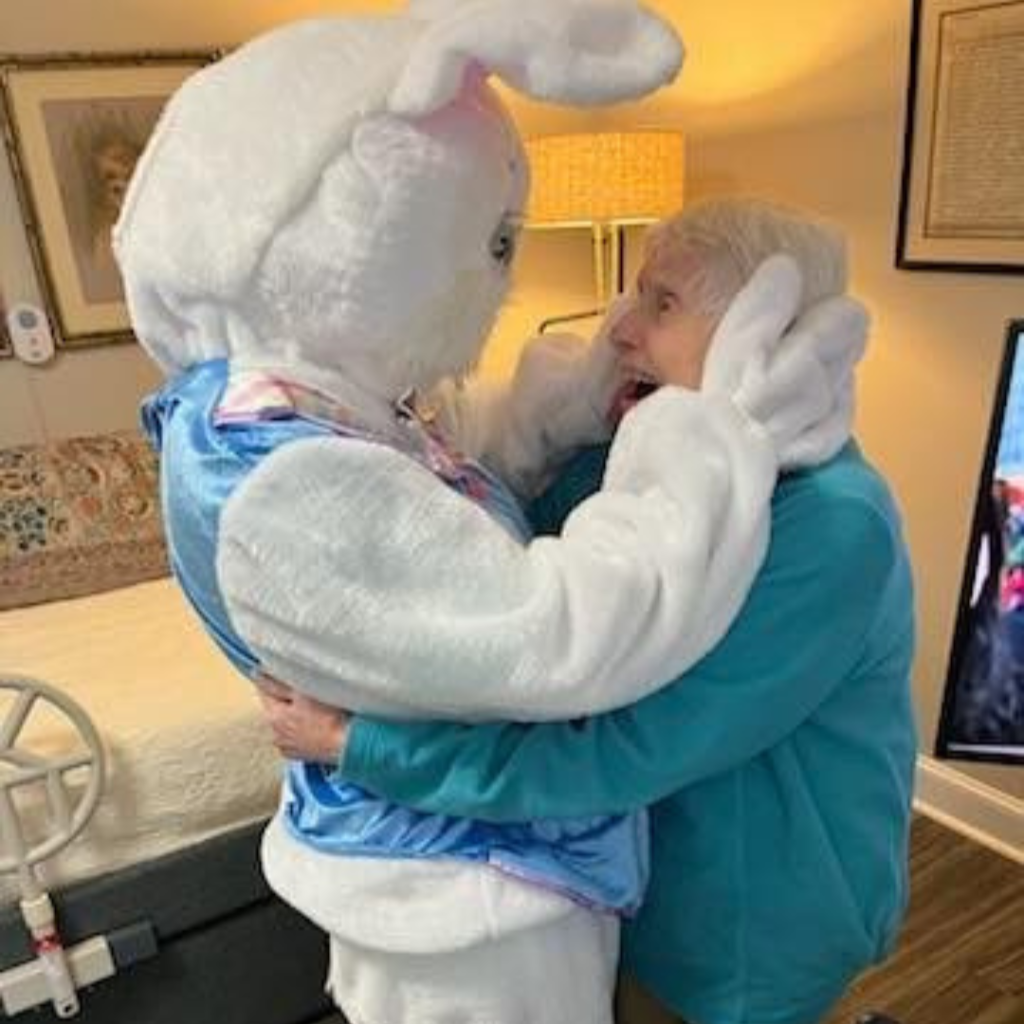 Resident and Easter bunny embrace