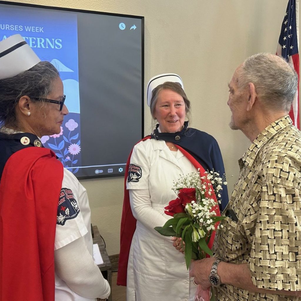 Nurses visit residents in uniform