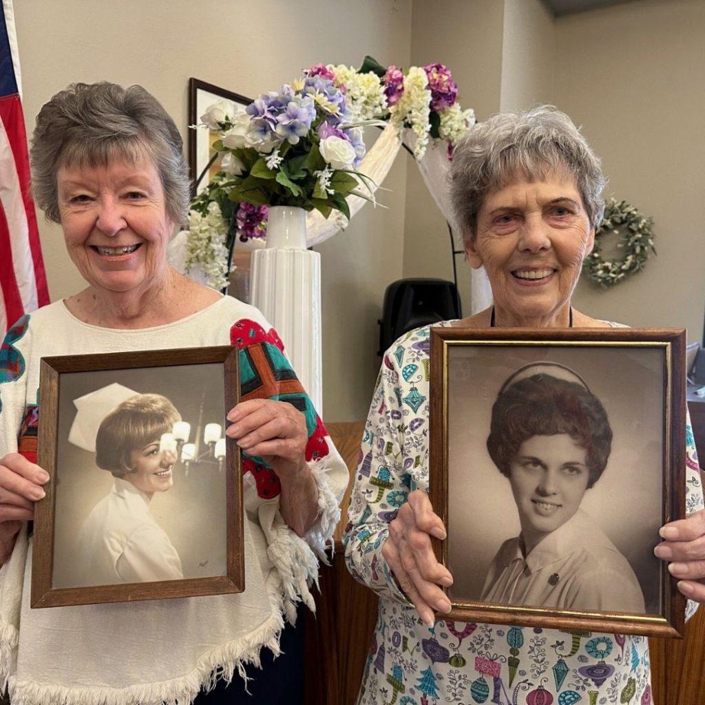 Residents pose with their nurse portraits