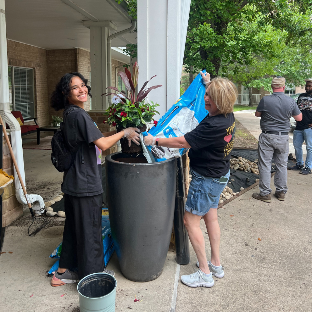 Support Center team helps community with outdoor work