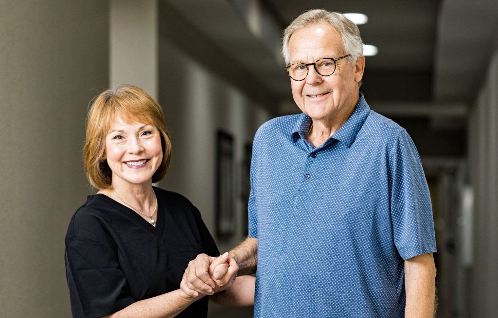 Resident and team member smiling